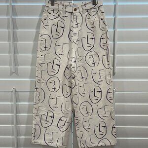 Shekou "Little Things" white denim jeans with a black abstract face print